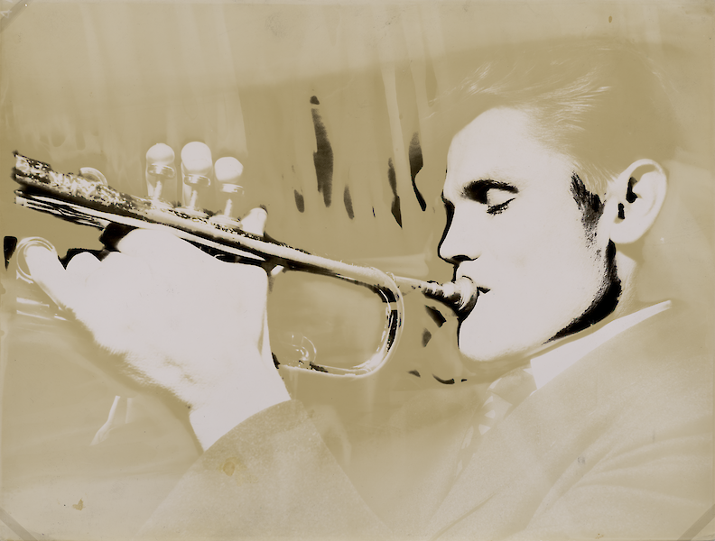 Photo of Chet Baker with trumpet, intentionally faded to a yellow tone in parts